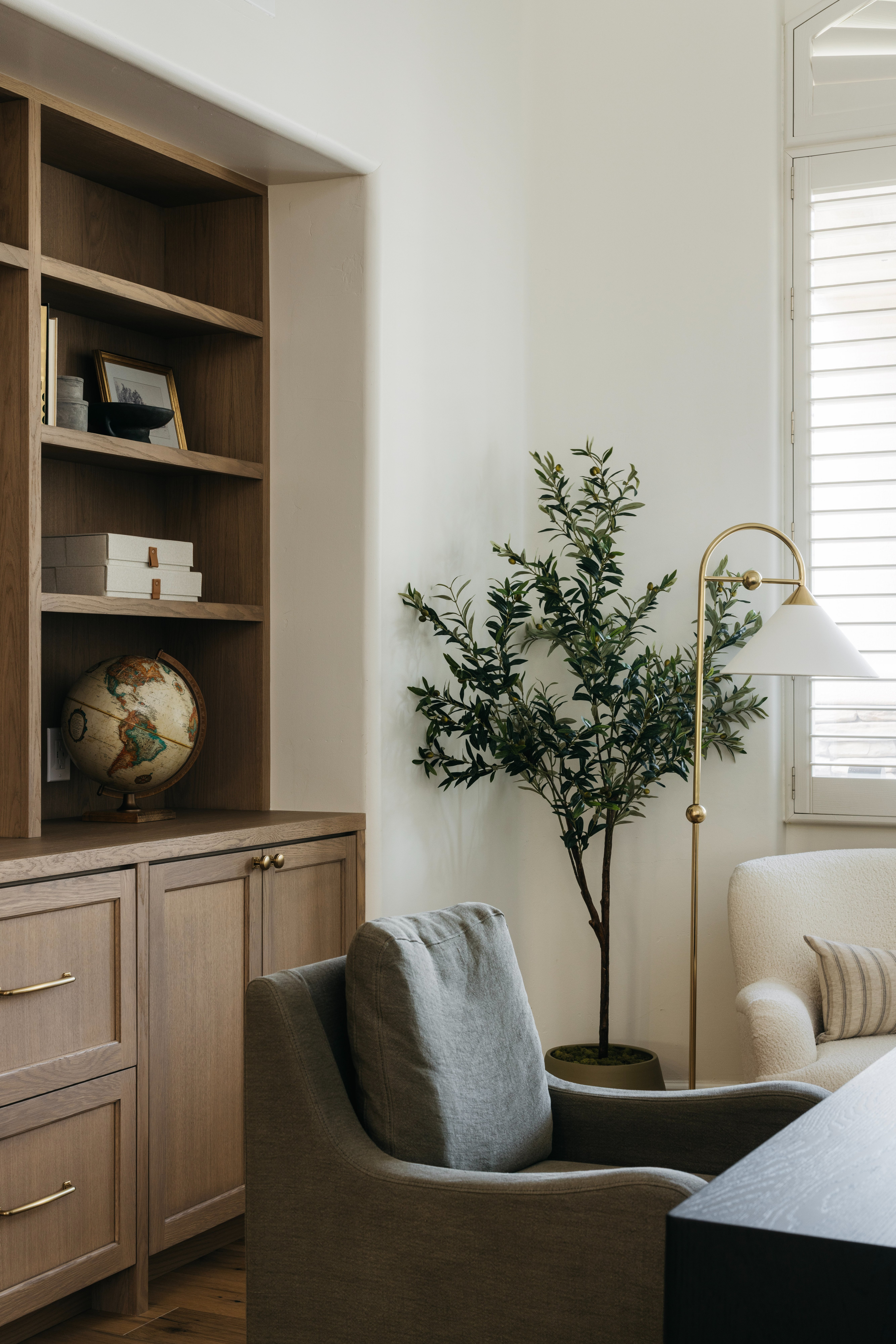 Office corner with shelving, globe and floor lamp, Heirloom House