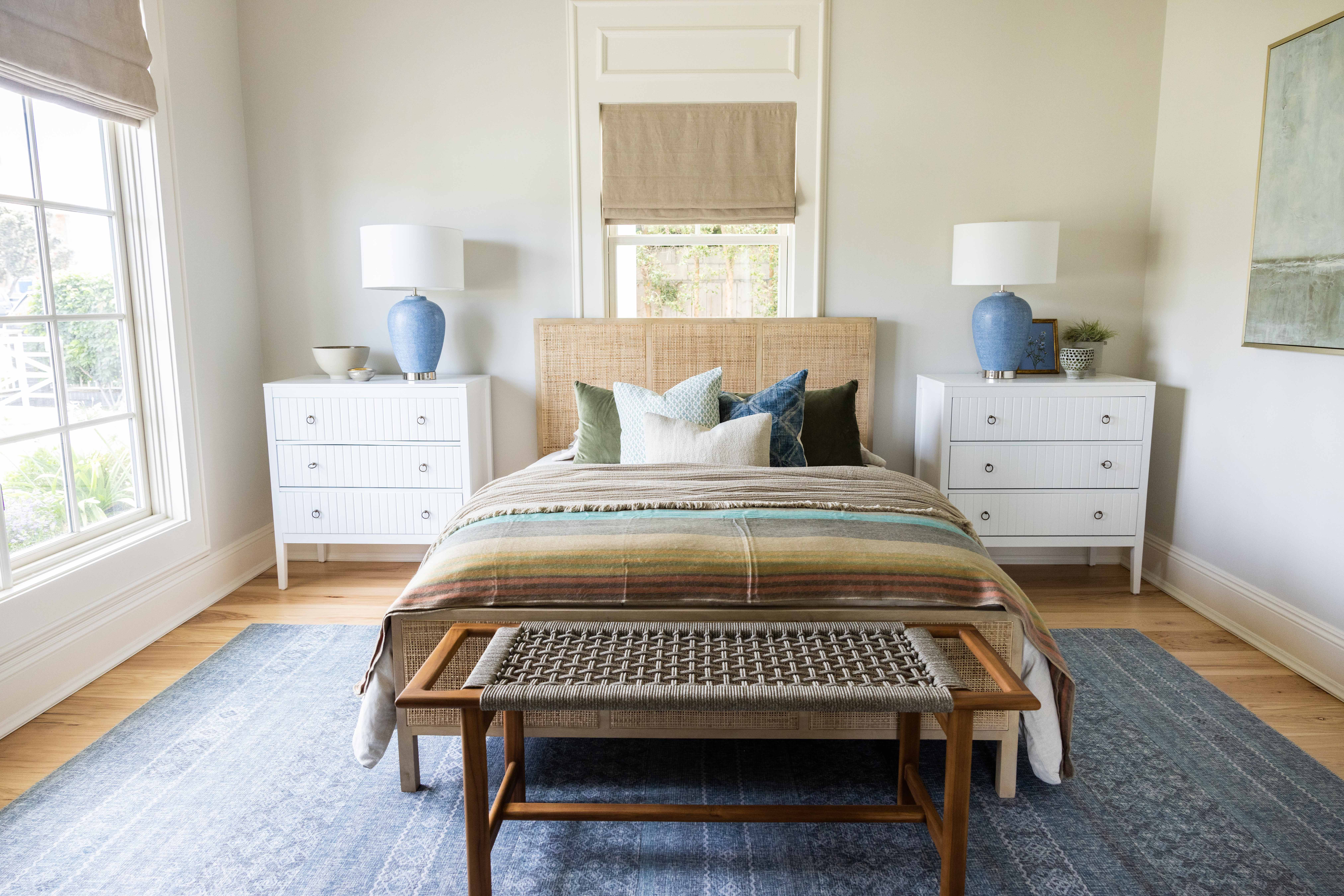 Bedroom with blue lamps and woven headboard, Seaside Retreat