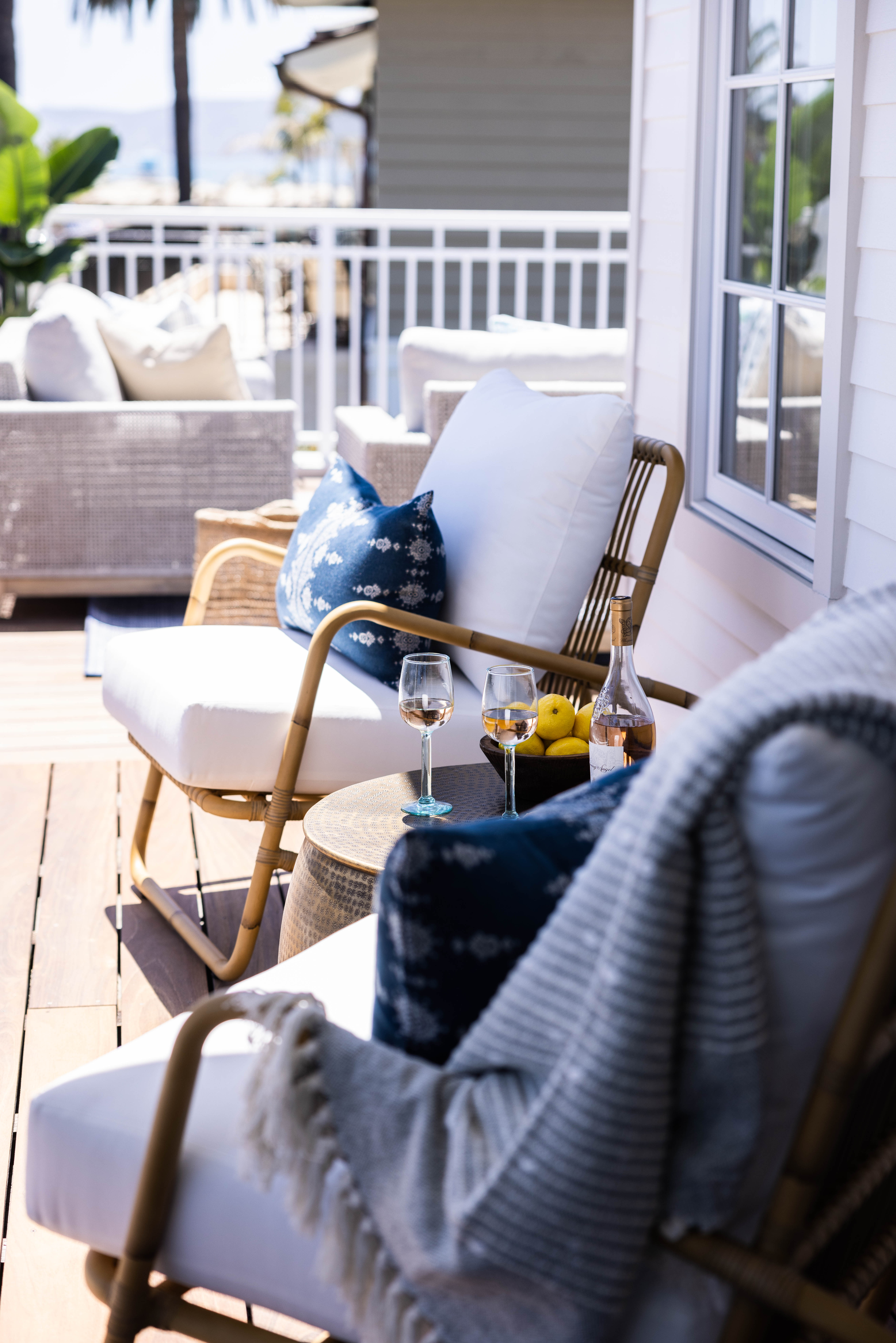 Outdoor patio detail with rattan chairs, Seaside Retreat