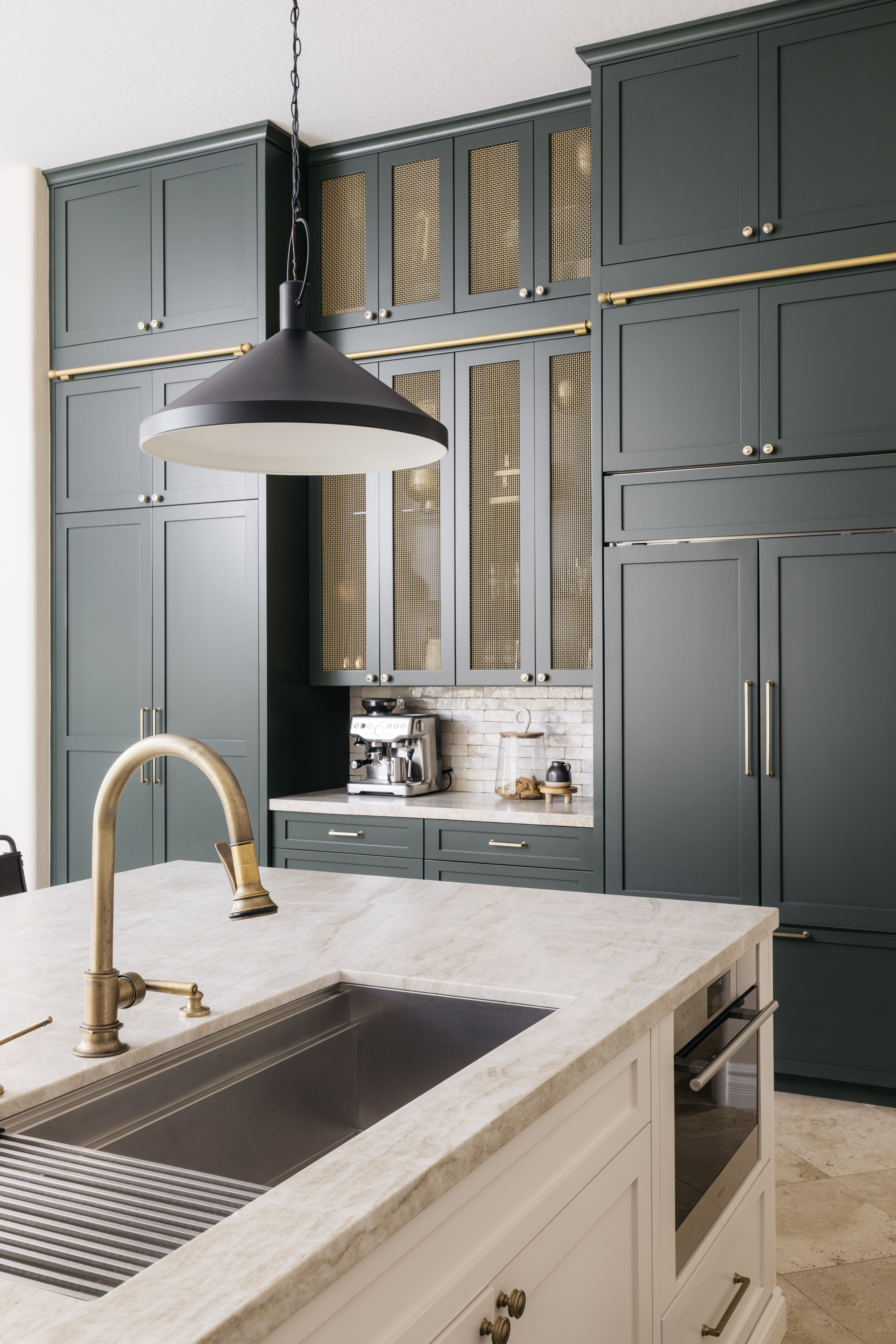 Dark green kitchen wall with mesh cabinets, The Considered Home